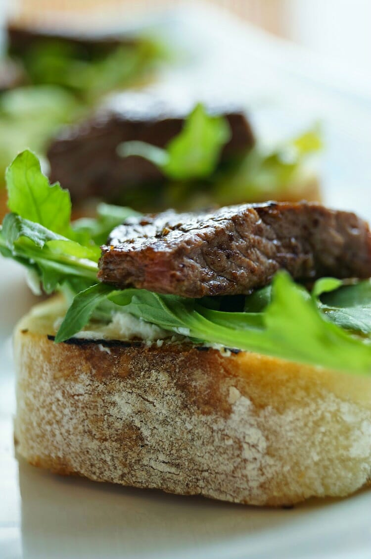 Balsamic Beef Crostini with Herbed Cheese and Arugula 