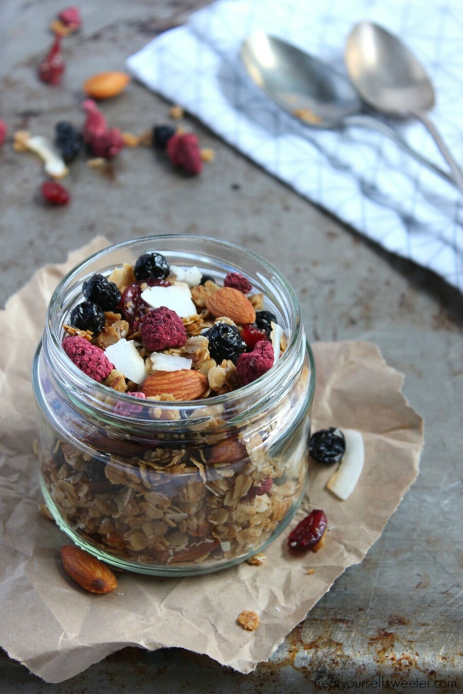 Toasted Summer Berry Granola; crispy, crunchy, sweet summer berry granola with oats and coconut. So delicious, you'll want to eat it by the handful!