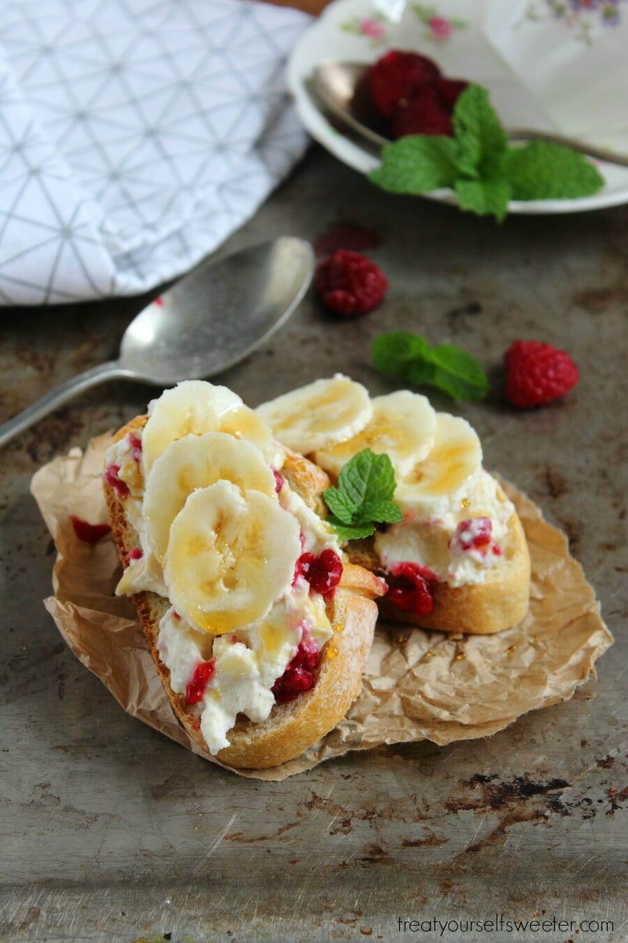 Honey Ricotta Toast with Raspberries and Banana; crunchy toast smothered with creamy, sweet honey ricotta, raspberries and banana. Quick, easy & perfect for brunch!