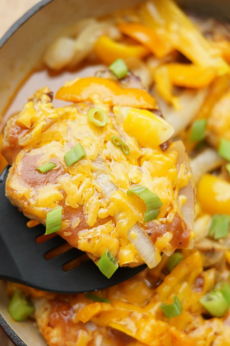 One Pan Smothered Pork Chops with Peppers, Onions, Cheese, and a Creamy BBQ Sauce