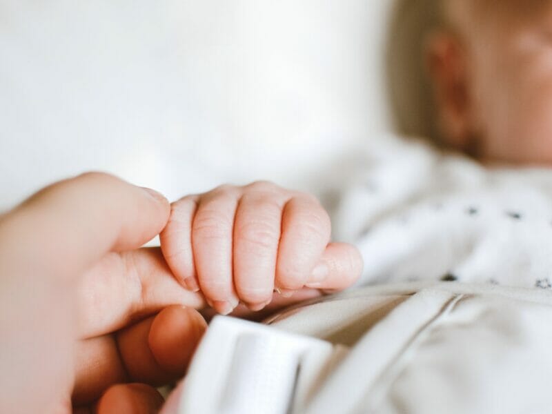 Person Holding Baby's Hand