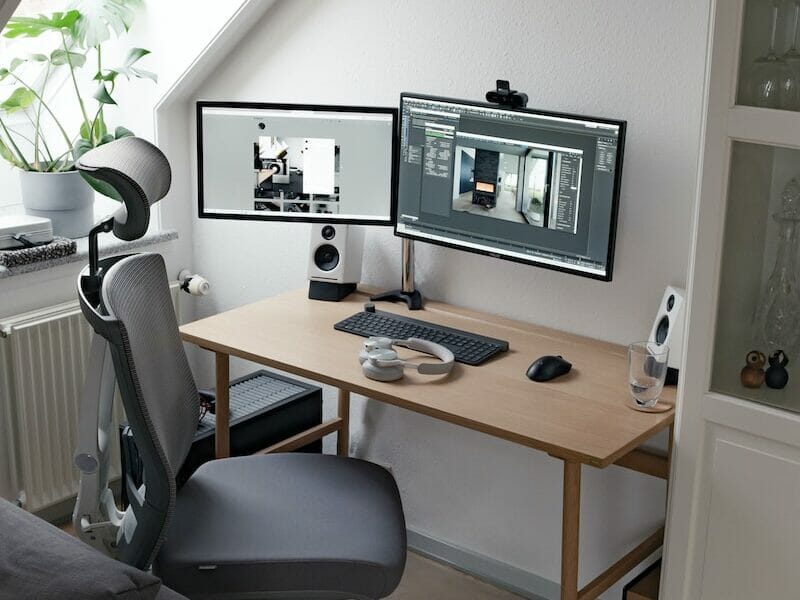 black flat screen computer monitor on brown wooden desk