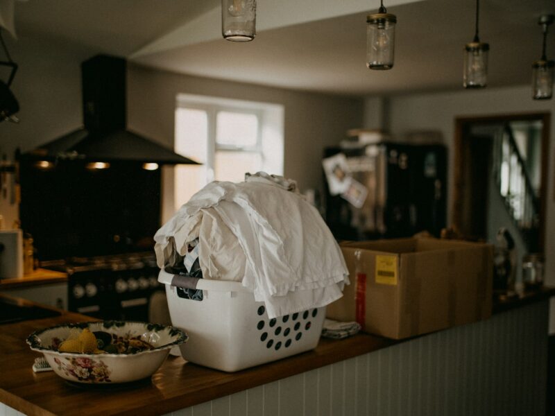 a laundry basket sitting on top of a wooden counter