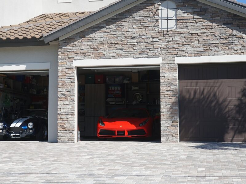 a car is parked in the garage of a house