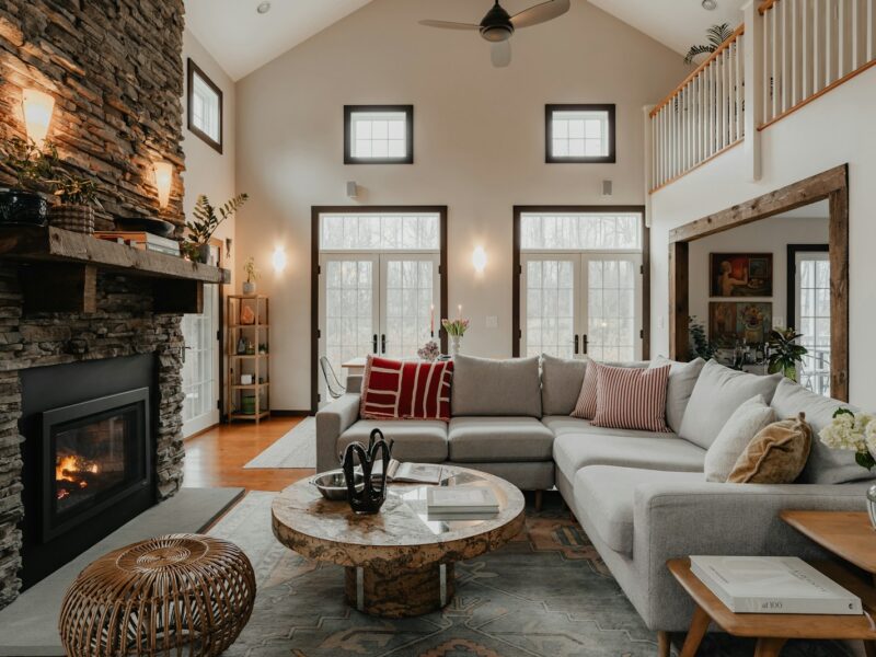 a living room filled with furniture and a fire place