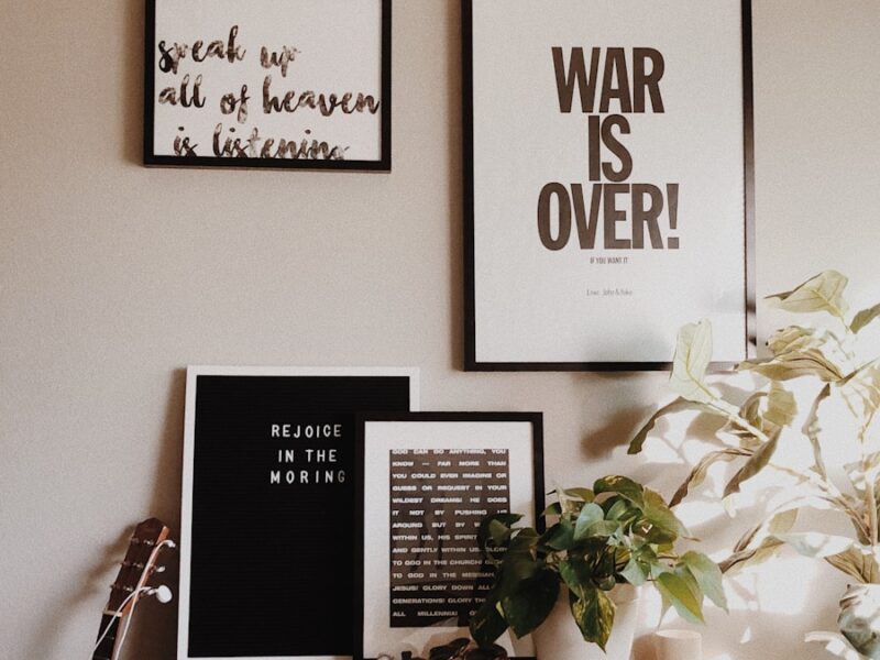 War is Over sign on wall inside room