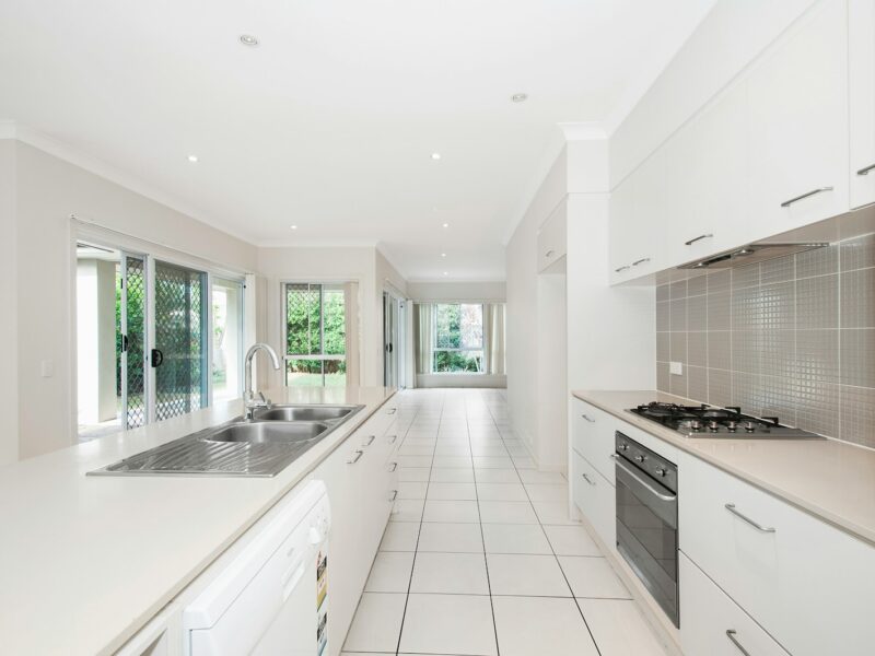 white wooden kitchen cupboards