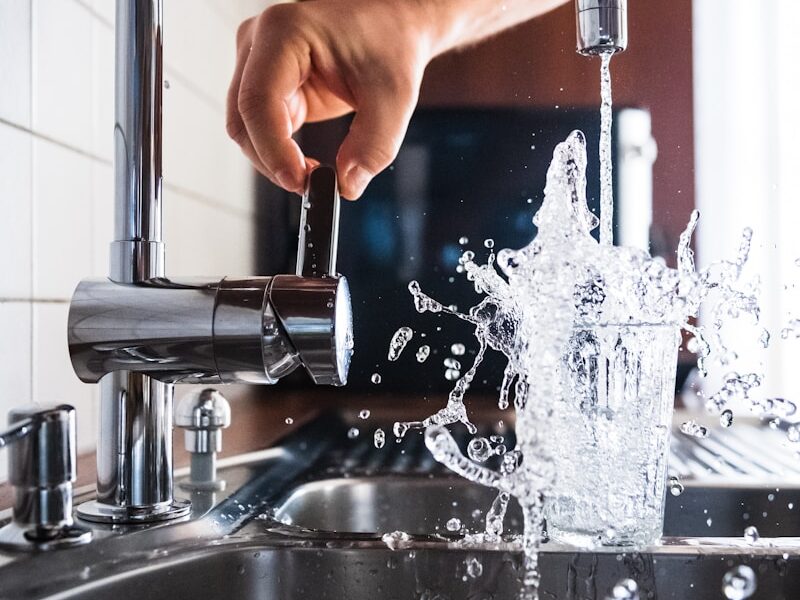 person opening faucet