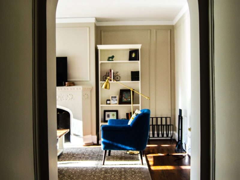 red fabric sofa on gray area mat inside room