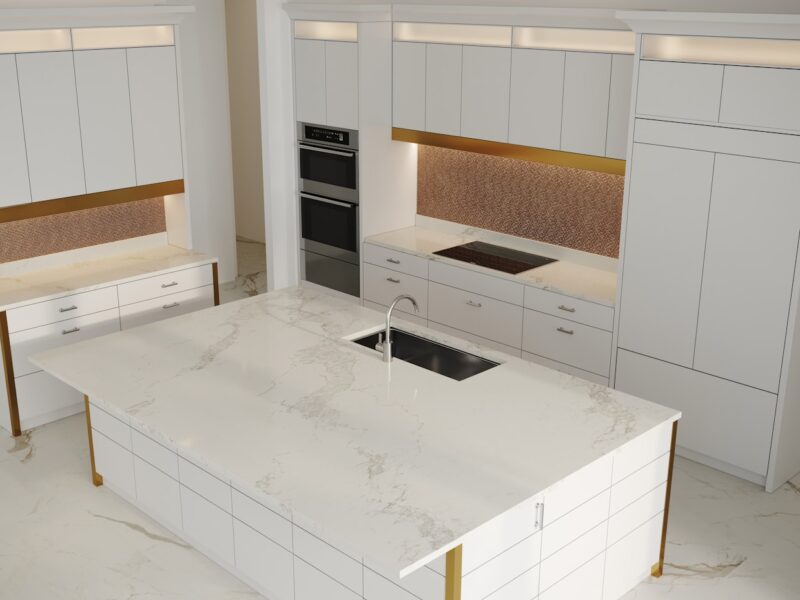 a kitchen with a marble counter top and white cabinets
