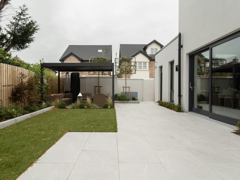 a house with a large yard and a covered patio
