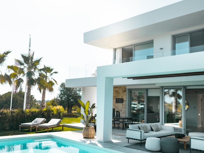 white concrete building with swimming pool