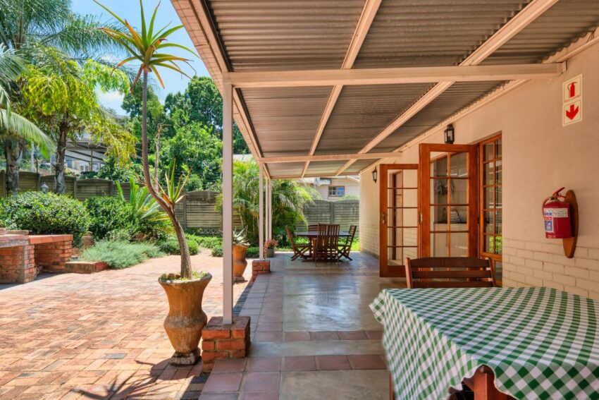Inviting patio in Pretoria, South Africa with lush greenery, ideal for relaxing outdoors.