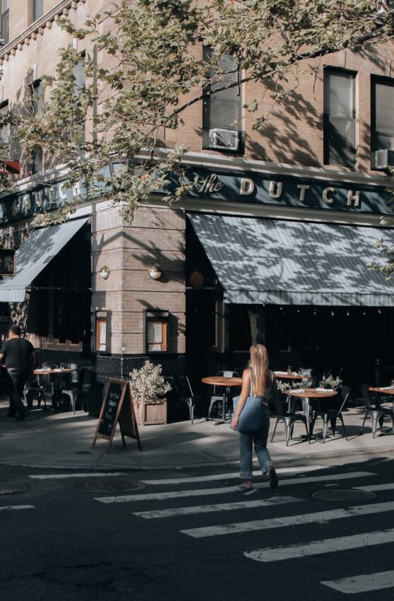 Street view in New York featuring The Dutch restaurant in daylight.