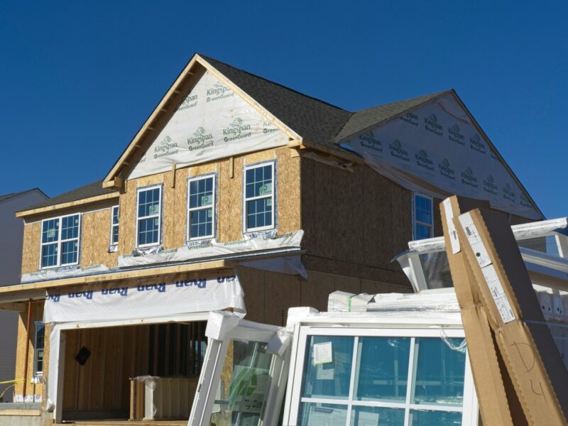 a house under construction with the roof ripped off