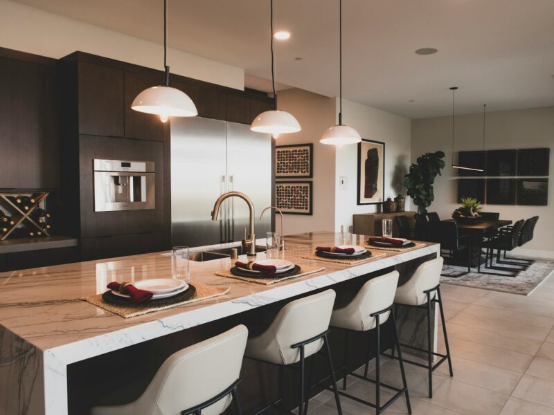 a kitchen with a marble counter top and a center island