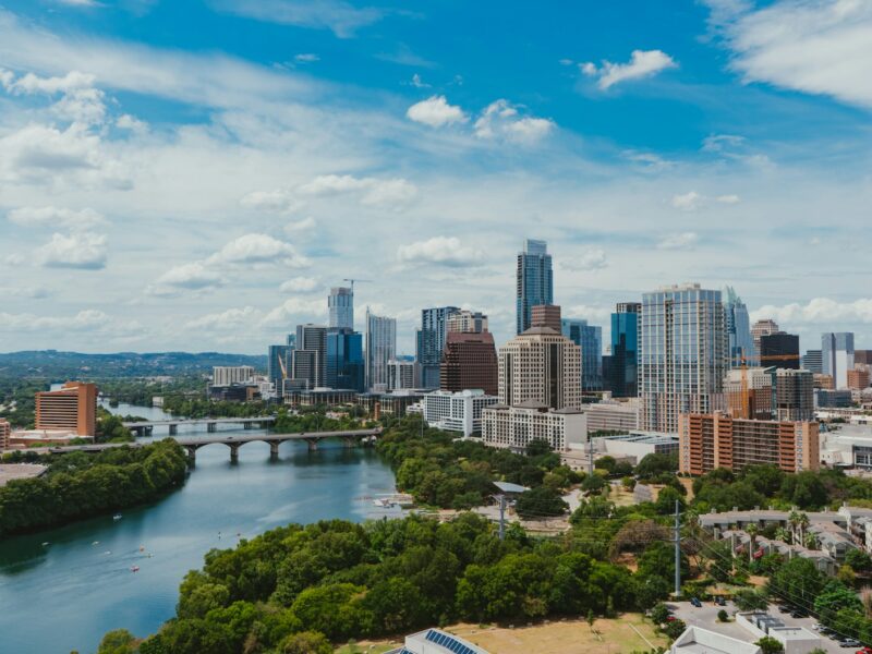 river near buildings during daytime