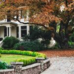 A large white house with a garden in front of it