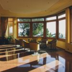 a large room with a lot of windows and chairs