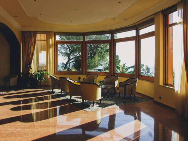 a large room with a lot of windows and chairs