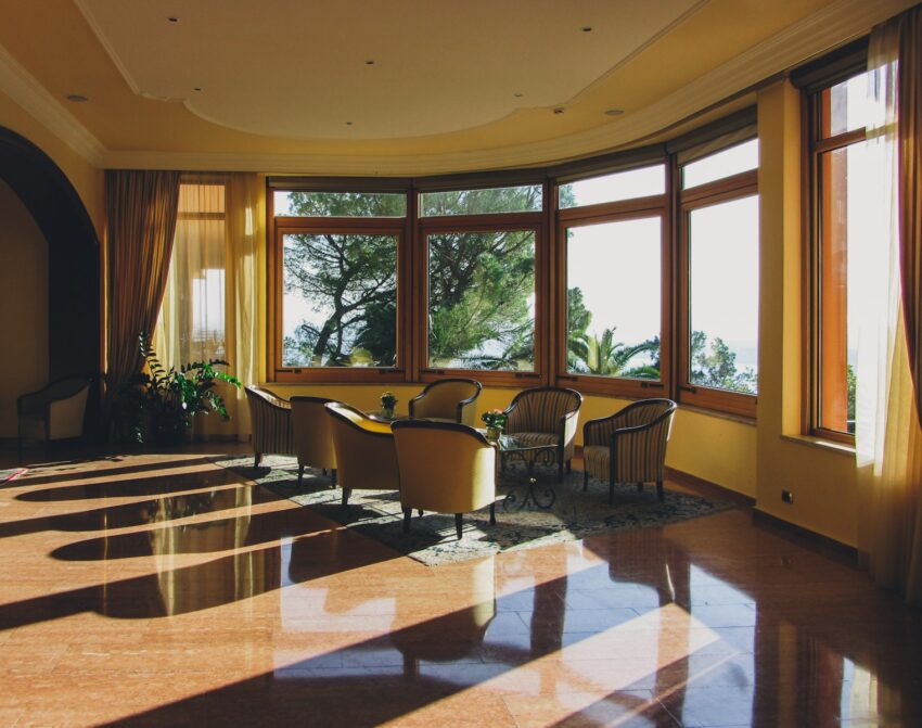 a large room with a lot of windows and chairs