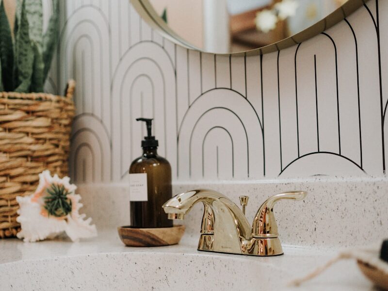 a bathroom sink with a mirror above it