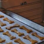 a cookie sheet with dog bones and bones on it