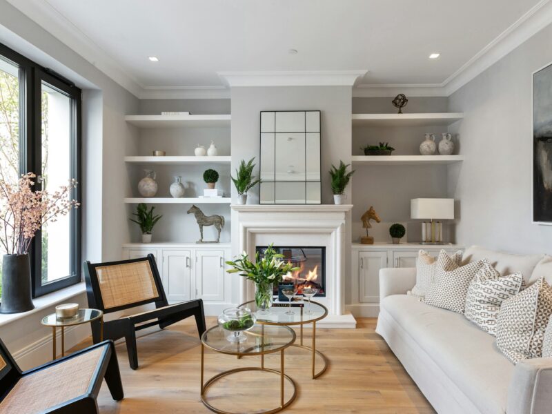 a living room filled with furniture and a fire place