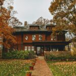 brown and black wooden house surrounded by trees