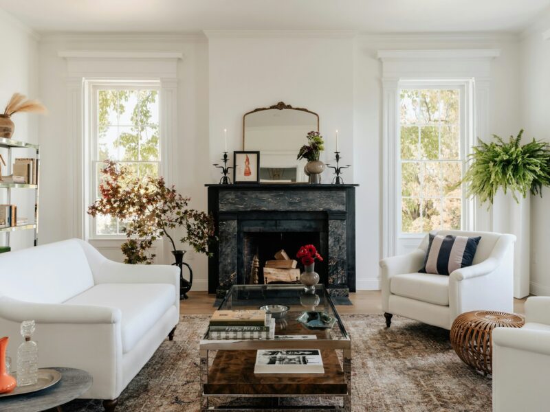 A living room filled with furniture and a fire place