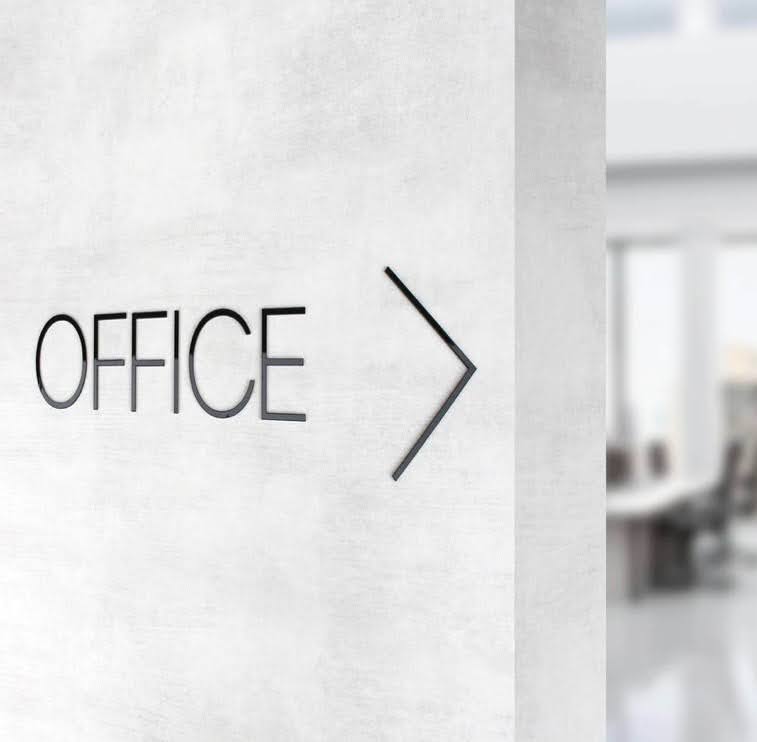 Office directional wall sign with an arrow