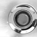a close up of a metal sink drain