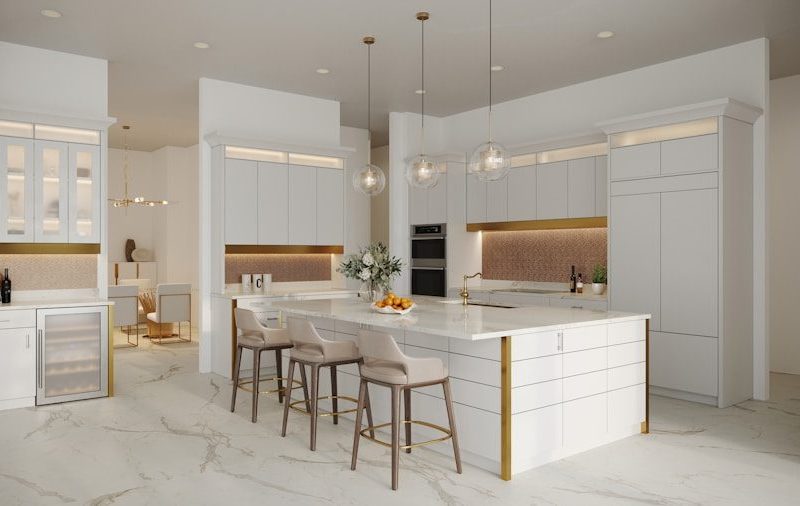 a kitchen with a marble counter top and white cabinets
