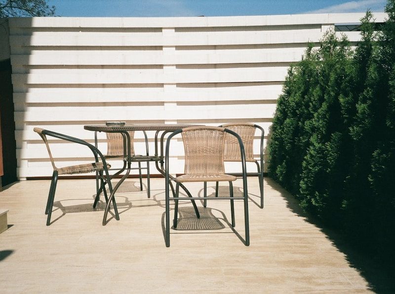 black metal framed white wooden table and chairs