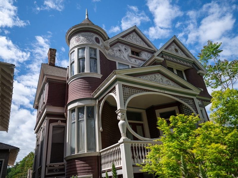 a large house with a clock on the front of it