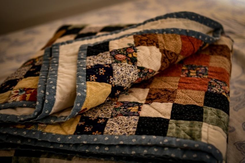 display your inherited quilts for a warm cottage feel 