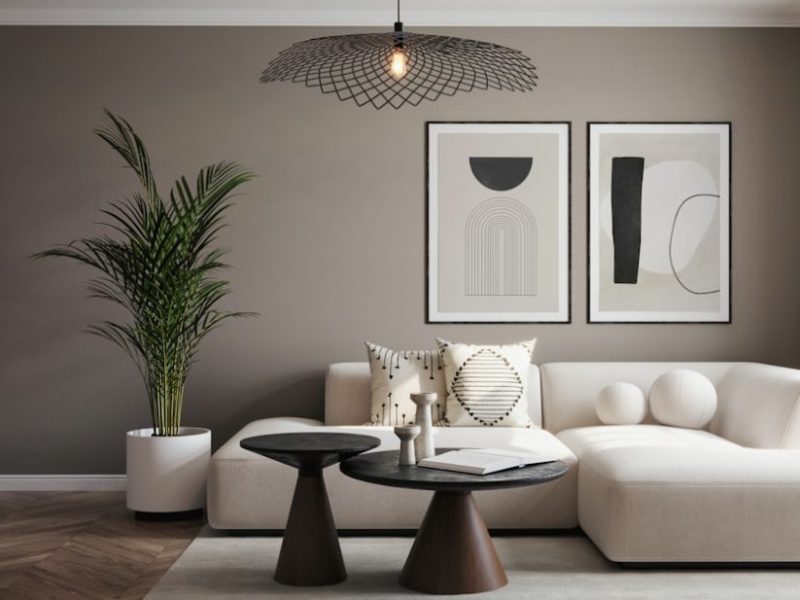 A living room with a white couch and a table