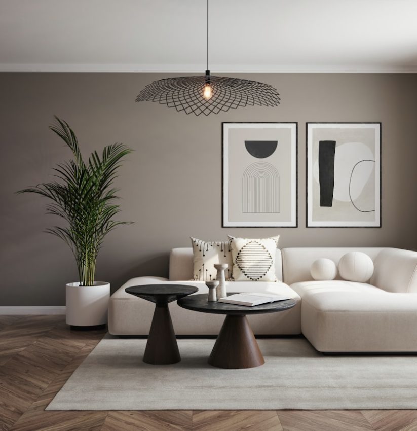 A living room with a white couch and a table