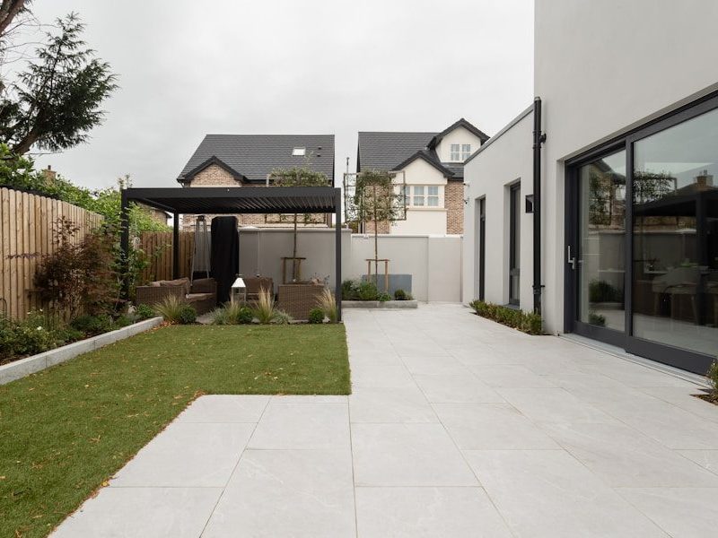 a house with a large yard and a covered patio