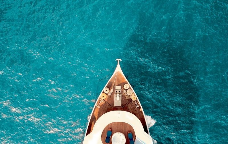 birds eye photography of boat on body of water