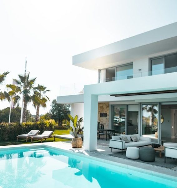 white concrete building with swimming pool