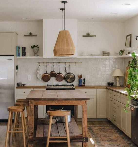rustic kitchen with wooden island and stools