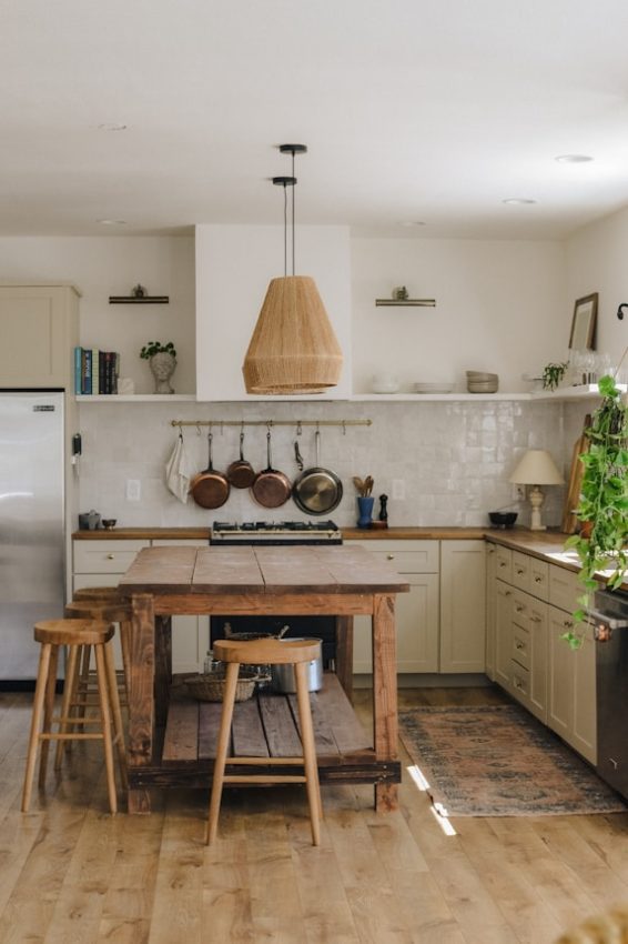 rustic kitchen with wooden island and stools
