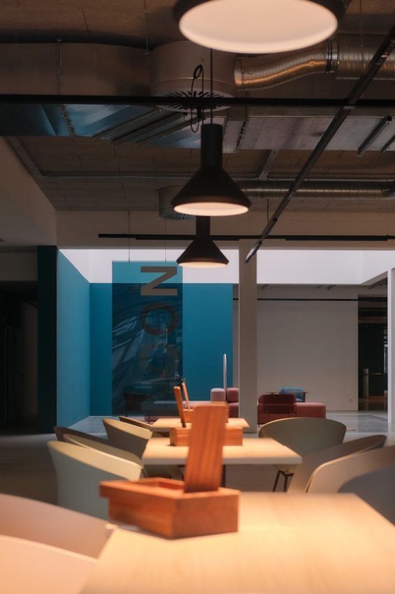 Modern office space with pendant lights and desks